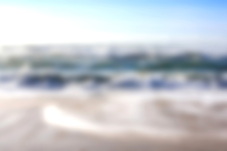 Blur summer white sand beach with sparkling sea waterの写真素材