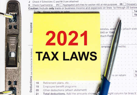Yellow paper with text 2021 tax laws, conceptの写真素材