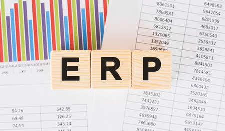 ERP word written on wood block. Faqs text on tableの写真素材