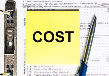 Yellow paper with text Cost.の写真素材