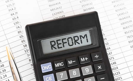 Calculator with the word Reform on the display.の写真素材