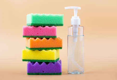 Pile of cleaning sponges on pink background. Household, cleaning and washing conceptの写真素材