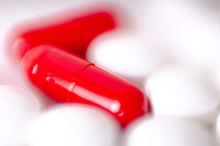 Image of red and white pills on white background. Medicine conceptの写真素材