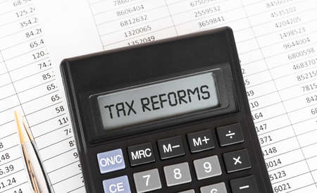 Calculator with the word Tax Reforms on the display.の写真素材