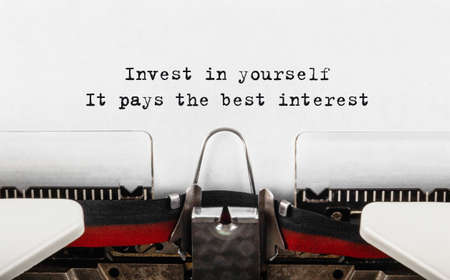 Text Invest in yourself typed on tpewriter.の写真素材
