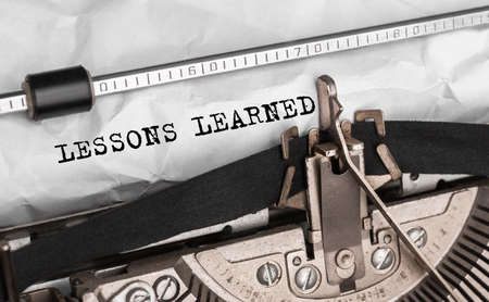 Text LESSONS LEARNED typed on retro typewriterの写真素材