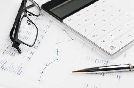 Calculator, Charts and Graphs spreadsheet paper. Finance, Accounting, Statistics and business concept.の写真素材
