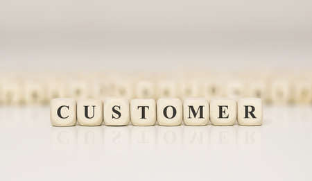Word CUSTOMER written on wood block. Business conceptの写真素材