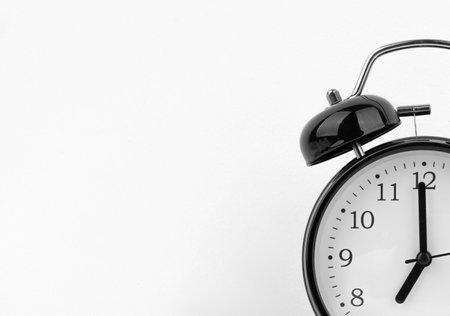 Black alarm clock on white backgroundの写真素材