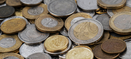 A pile of gold and silver coins.の写真素材