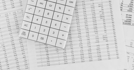 Calculator on financial statement. financial and business concept. top view.の写真素材