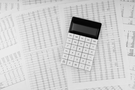 Calculator on financial statement. financial and business concept. top view.の写真素材