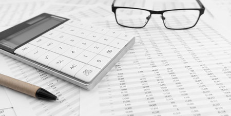 Calculator and eyeglasses on financial statement. top view.の写真素材