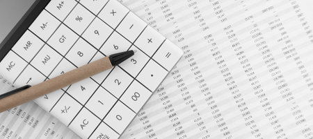 Calculator with pen on financial statement. financial and accounting concept.の写真素材