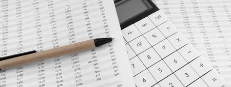 Calculator with pen on financial statement.の写真素材