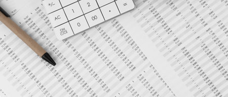 Cose up view of calculator with pen on financial statement. financial and business concept.の写真素材
