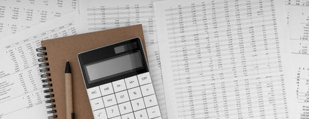 Calculator with notebook on financial statement.の写真素材