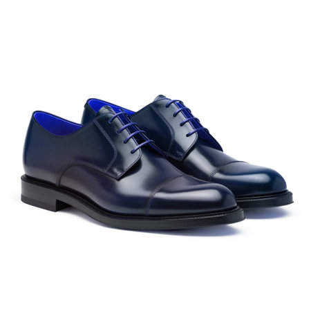 Blue male shoes isolated on white background. Clipping path included.の素材