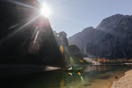 Fisherman in a boat on Lake Braies, Dolomites, Italyの写真素材