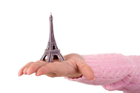 hand showing the model of the tour eiffel on the white background with copycpaseの写真素材