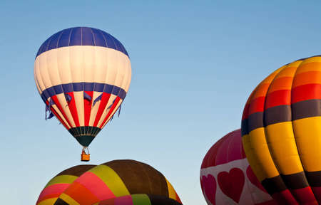 Hot air balloons inflating and ascending at the Colorado Balloon Classicの写真素材
