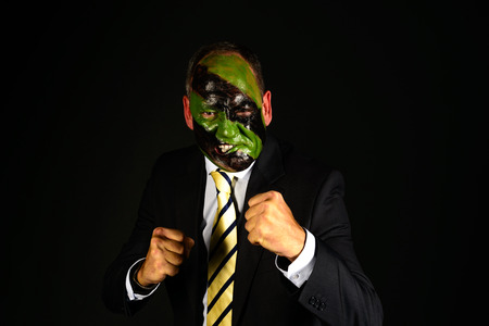 jungle camouflage paint businessman withの写真素材