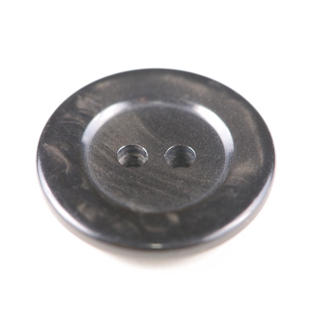 Old black button isolated on white backgroundの写真素材