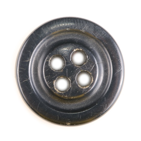 Old black button isolated on white backgroundの写真素材