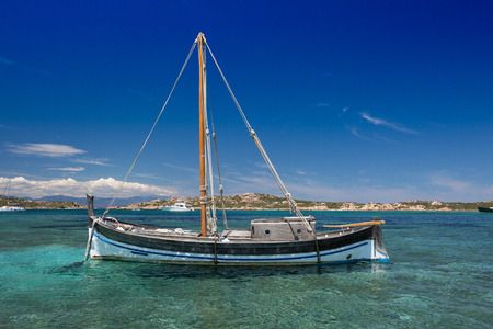 An old classic sailboat near the beach in Italyの写真素材