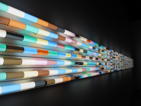 Fluorescent lamp wall decoration / Colorful light tubes shining in the darkの写真素材