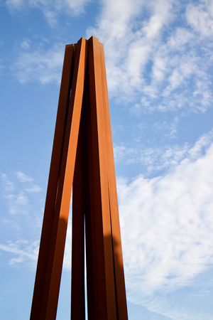 Metal sculpture in French town of Nice / Vertical iron beams in a cone shapeの写真素材