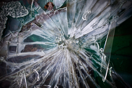 Green glass shards - Sharp pieces of a window smashed broken