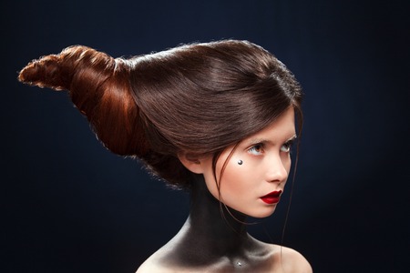 Beautiful girl with a hairs in the form of horns.の写真素材