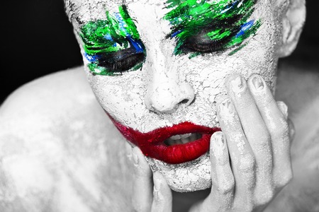 Horror portrait of a girl with an creative make-up in joker styleの写真素材