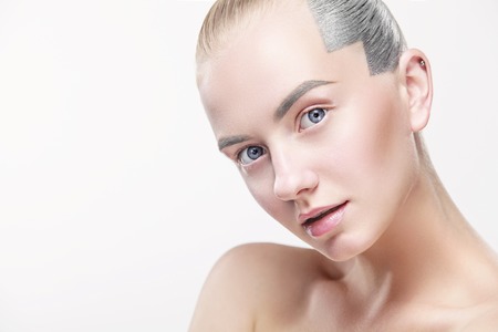 Portrait of beautiful young blond woman with clean face. High key shot.の写真素材