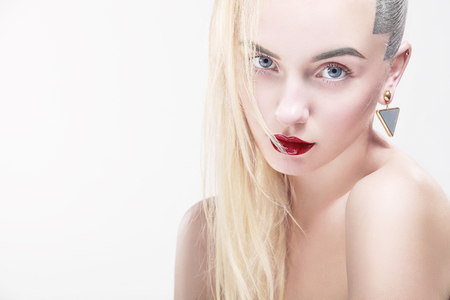 Portrait of beautiful young blond woman with clean face. High key shot.の写真素材