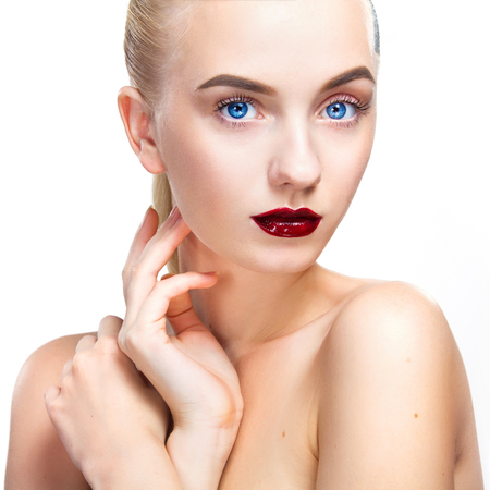 Close-up portrait of sexy blonde girl with makeup. Beautiful model, silver hairstyle. isolated on white background. For cosmetics advertisment.の写真素材