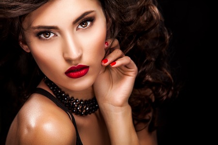 Stylish night flash fashion portrait of trendy casual young woman in black dress.の写真素材