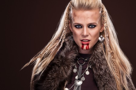 Viking woman in a traditional warrior clothes.の写真素材