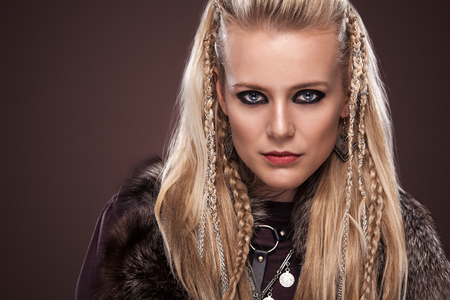 Viking woman in a traditional warrior clothes.の写真素材