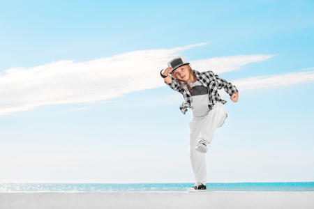 Fashion child dancing over sky background.の写真素材