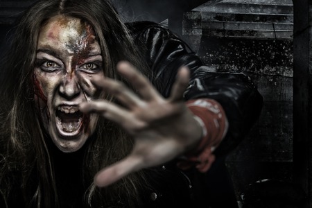 Close-up portrait of horrible zombie woman with wounds. Horror. Halloween poster.の写真素材