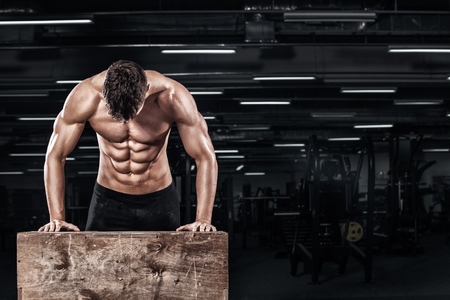 Handsome muscular man workout at crossfit gymの写真素材
