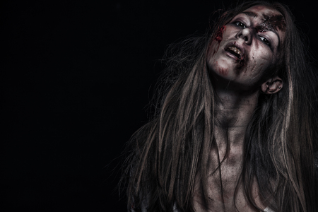 Zombie woman, Horror background for halloween concept and book cover. Copy space.の写真素材