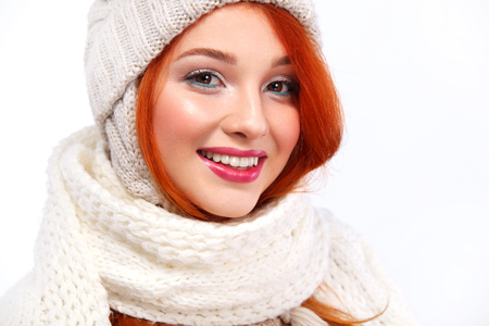 Portrait of beautyful redhead happy woman on white background with copy space. Christmas and New Year concept.の写真素材