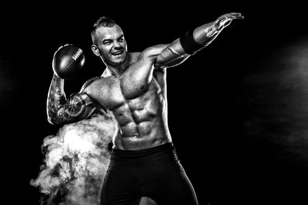 Sport concept. American football sportsman player on black background. Sport concept.の写真素材