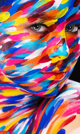 Portrait of the bright beautiful emotional woman with art make-upの写真素材