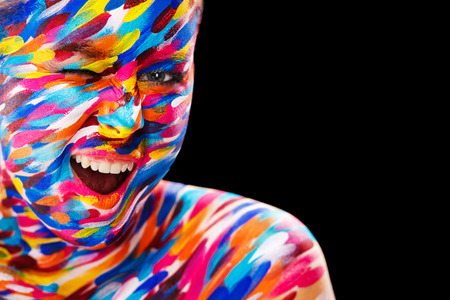 Portrait of the bright beautiful girl with art colorful make-up and bodyartの写真素材