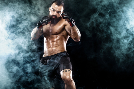 Sportsman boxer fighting on black background. Copy Space. Boxing sport concept.の写真素材