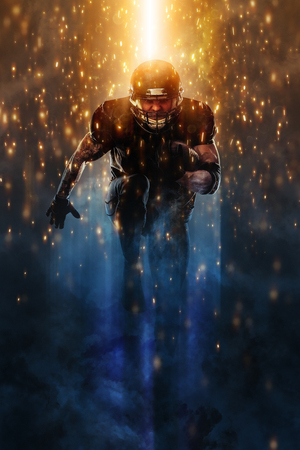 Strong athletic man. American football sportsman player running. Sport moution concept.の写真素材